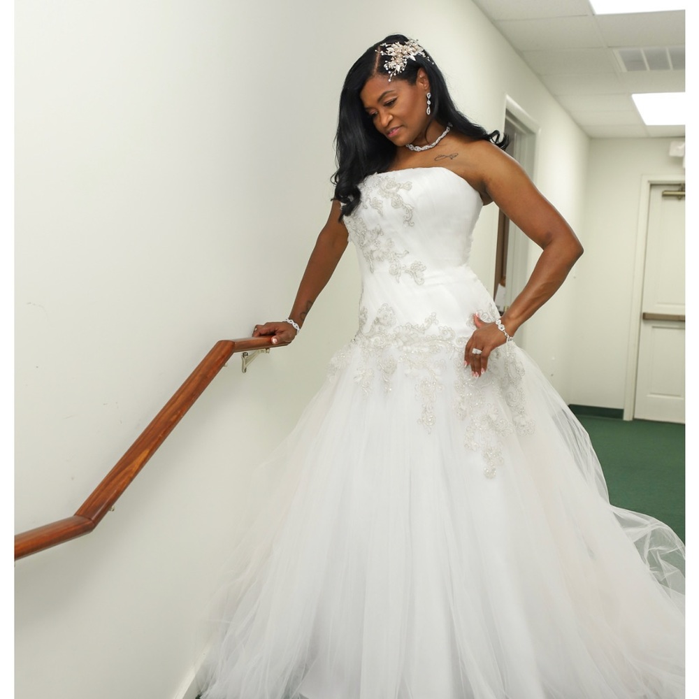 Worn only 2 hours for my wedding not altered.
